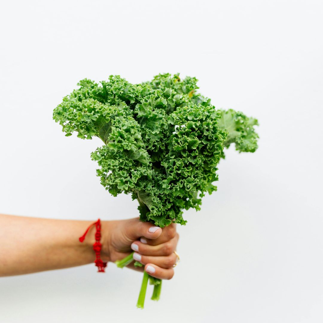 Bowl of winter citrus fruits, leafy greens, and seeds to support immune system naturally.